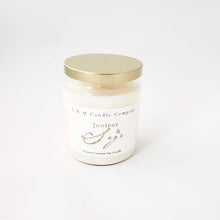 Load image into Gallery viewer, A juniper and sage coconut soy candle by L&amp;M Candle Company hand-poured in a clear glass vintage apothecary vessel and gold lid.
