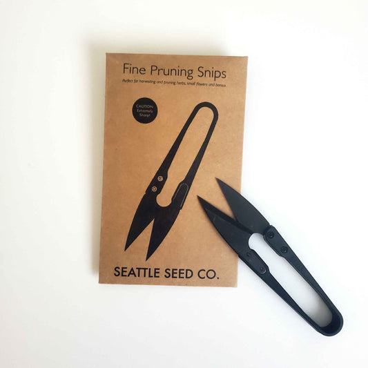 Black pruning snips with Seattle Seed Co. packaging on a white background